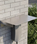 Heavy Duty Stainless Steel Ev Charger Rain Cover Weather Resistant Outdoor Charging Station Housing mounted on a brick wall.