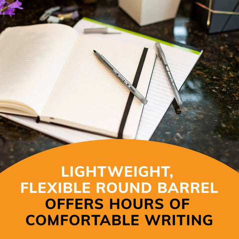 60 Count Round Stic Xtra Life Black Ballpoint Pens Deliver Top Shelf Writing With Smooth Gliding Ink on an open notebook.