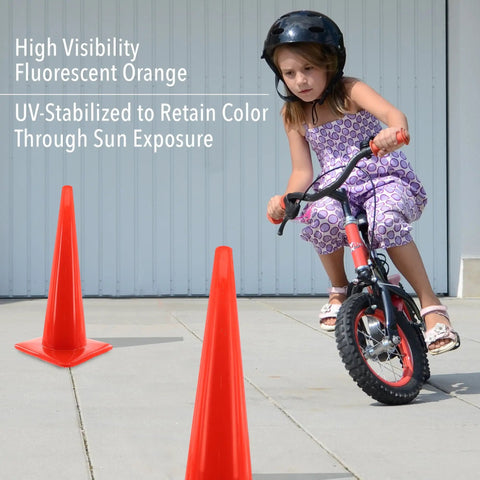 High Visibility Orange Safety Cone For Traffic And Worksites, 28 Inch Durable LDPE Cone in a play area with a girl biking nearby
