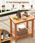 Acacia Wood Outdoor Side Table with slatted top and two-tier storage shelf for backyard poolside patio or indoor use in natural finish.