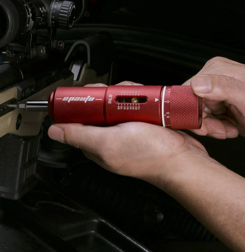 Close-up of hands using Versatile Manual Wrench And Screwdriver Set For Firearms And Bikes 28 Piece Tool Kit on firearm.