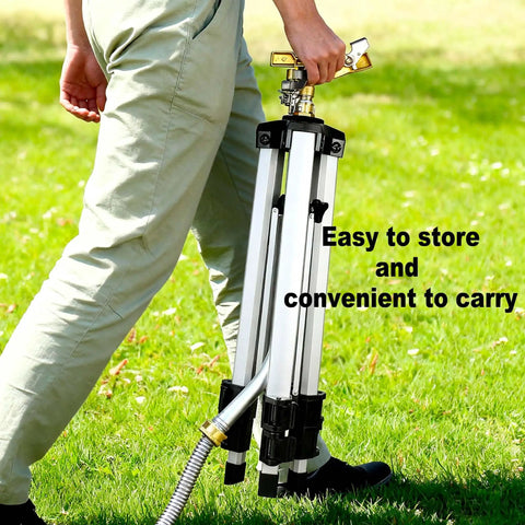 Person carrying a folded tripod lawn sprinkler, showcasing its portability. Tripod Lawn Sprinklers Pack Of 2 Heavy Duty 360 Degree Coverage For Yard And Garden Adjustable Height Tripod With Sprinkler Head Nozzle And Three Quarter NH Inlet Hose Connection Easy Setup And Wide Irrigation Reach.