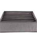 Slick Seven Compartment Folding Fabric Drawer Organizer for Underwear Socks And Hair Accessories To Quick Clean Up Your Bedroom Closet Space Without Any Sweat Or Hassle Today, gray fabric with seven divided sections.