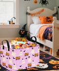 Lowkey Spooky Purple Ghost Storage Basket With Heavy Duty Cotton Linen Handles Dope Collapsible Organizer For Halloween Candy Toys in a bedroom.