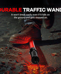 10 Pack 21 Inch Lit LED Traffic Safety Wand With 3 Flashing Modes For Parking Guides And Air Traffic Style Signals Lightweight PVC Baton That Runs On 2 C Batteries Not Included, shown on ground with foot stepping on it