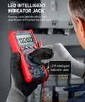 Electrician using True RMS 6000 Counts Auto Ranging Digital Multimeter with LED indicator jack in a control panel.