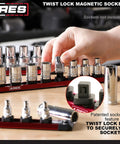 15.5 Inch Red Twist Lock Magnetic Socket Rail Set For Toolbox Organization, Holds 36 Sockets on wooden surface, hand reaching.