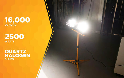 Twin 500 Watt Portable Halogen Work Light With Telescoping Stand, bright illumination in dim garage setting.