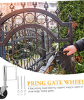 Badass Heavy Duty Spring Loaded Gate Caster Acts As Shock Absorber Over Uneven Terrain Rolls Sweet Smooth, mounted on a decorative gate.