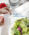 Heavy Duty Clear Sealable Zip Pouches 100 Pack 13 By 18 Inch Airtight Storage Bags For Merchandise Packaging And Shipping Supplies Tough As Nails And Go To Thick Virgin Ldpe Construction Water Resistant Closure with salad and zipper visible.