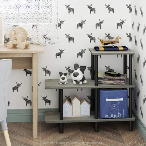 Three Tier Ladder Shelf Cube Bookcase For Bedroom Living Room Or Home Office Slick French Oak Grey With Black Tubes in a corner with toys and decor.