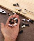 40 Pack Straight Up Shutter Repair Pins with Tough Spring Loaded Heads on hand, showing various colors and sizes for easy installation.