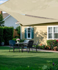 Installed Right Triangle Beige Shade Sail 8x8x11.3 Ft Air Permeable HDPE Shade Cloth over patio in backyard lawn