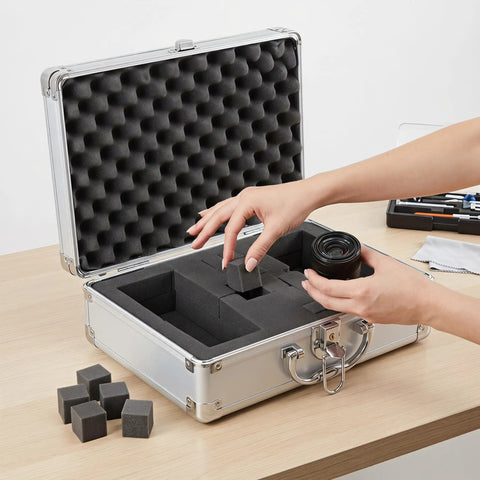 Tough As Nails Lockable Aluminum Alloy Toolbox With Shock Absorbing Foam Insert showing opened case with foam insert and camera lens.