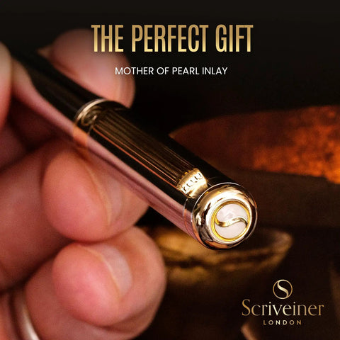 Luxurious Silver Chrome Ballpoint Pen With Real Gold Plating And Schmidt Black Refill close-up in hand with mother-of-pearl inlay.