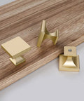 Solid As Nails 5 Pack Square Cabinet Knobs Brushed Brass Finish Zinc Alloy Drawer Handles on wooden surface