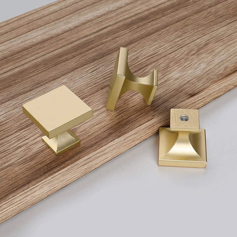 Twenty Pack Premium Gold Cabinet Knobs And Sturdy Drawer Pulls Featuring A Sleek Brushed Brass Finish Boss Level Zinc Alloy Furniture Hardware on a wood surface