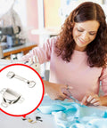 Woman sewing fabric with scissors, focused on Super Tough Stainless Steel Hook And Eye Closures For Pants Skirts And Dresses Nickel Sewing Notions.