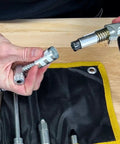 Close-up of LockNLube 8-piece quick-connect grease kit; knurled metal fittings and hose in rip-stop carrying case.