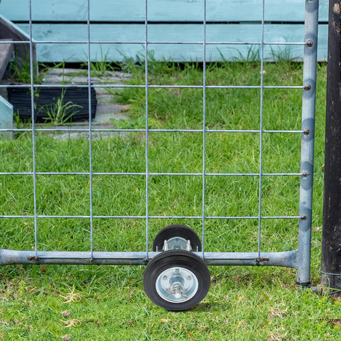 Heavy Duty Sliding Door Rollers with Secure Lock attached to a metal gate, shown on green grass for smooth operation.