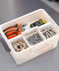 Top view of 17 Quart Clear Plastic Storage Bins With Four Compartment Removable Tray, containing tools and parts, in bright orange.