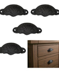 Set of 4 Black Cast Iron Cup Drawer Pulls Featuring Mystic Colonial Medieval Design on vintage dresser with easy grip handle.