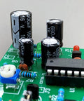 Close-up of Killer Aluminum Electrolytic Capacitor Assortment Kit with 1000uF and 680uF capacitors on a circuit board.