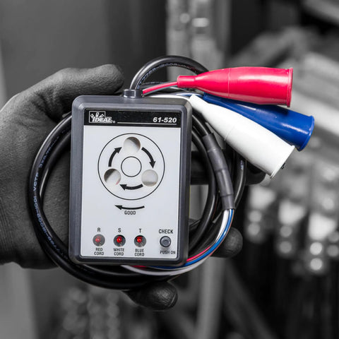 Hand holding a 3 Phase Sequence Tester With Color Coded Insulators for quick accurate phase sequence and continuity checks.