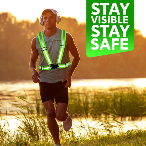 Man wearing high visibility reflective safety vest bulk pack for men and women, breathable mesh lime color, jogging outdoors at sunset