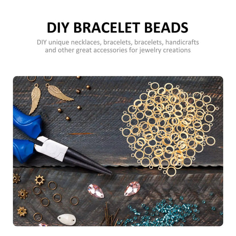 Top Shelf Stainless Steel Bail Beads For Jewelry Making Supplies Featuring Durable Charm Hangers and Smooth Spacer Beads on a wooden surface.