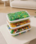Ridiculously Tough Clear Hard Shell Zipper Cases Including Three Diaper Bag Organizer Pouches stacked with colorful building blocks.