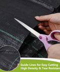 Heavy Duty Weed Barrier Landscape Fabric Pro Grade 4 Ft By 100 Ft Ground Cover For Gardening And Farming 2 Pack being cut with scissors.