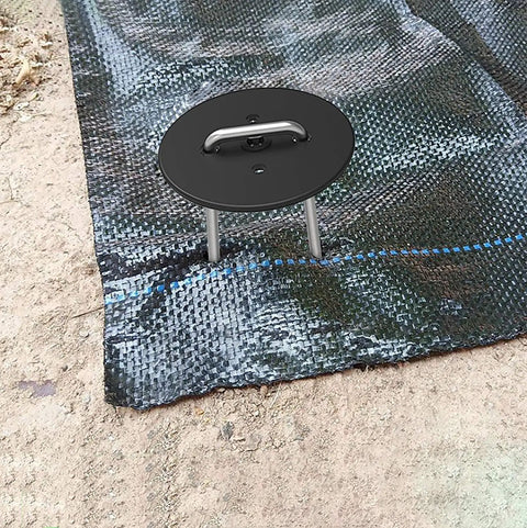 Installed heavy duty metal stake with gasket washer securing landscape fabric, part of 100 Pack 6 Inch Landscape Staples for garden use.