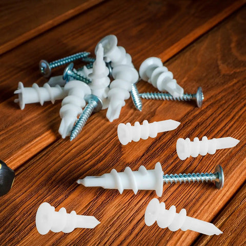White Plastic Drywall Anchors Kit With 300 Pieces For Heavy Duty Drywall Repair And Installation on wooden surface