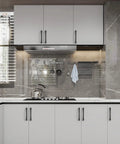 Modern kitchen featuring Kickass Five Inch Matte Black Kitchen Cabinet Handles Ten Pack on sleek white cabinets.