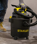 Powerful 5 Gallon Wet Dry Shop Vacuum With 4 Peak HP, 85 CFM, 3 In 1 Blower, shown on a garage floor with flexible hose.