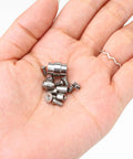 Heavy Duty Titanium Screw Pivot Upgrade Kit With Lanyard Tube Standoff Spacer And Blade Stop Hardware in hand showing various screws.