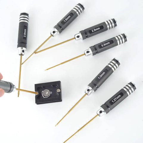 Heavy Duty Pro Grade Titanium Coated Hex Screwdriver Kit With Seven Precision Steel Bits For Fpv Racing Drones Rc Helicopters And Watercraft Hassle Free Tuning Gear showing hex screwdrivers in various sizes and use on a tuning tool.