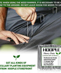 Person installing Tough As Nails Weed Barrier Landscape Fabric 3ft By 30ft with steel staples, commercial-grade ground cover.