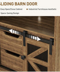 Sliding barn door mechanism on a wooden cabinet with deep drawers, showcasing industrial farmhouse design.