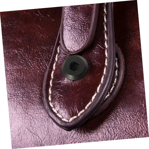Kickass Black Stainless Steel M6 X25 Chicago Screws And Barrel Nuts Five Pack secured on dark leather strap for crafting.