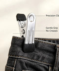 Slick Vertical Closet Organizer With Ten Heavy Duty Pant Clips For No Fuss Dorm And Apartment Storage Game Changing Hanging Setup For Jackets Pants And Delicates Tight Grip Design Wins, close-up of precision clip holding jeans.