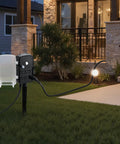 Built Tough Outdoor Power Stake With 100 Foot Extension Cord And Locking Weatherproof Cover, Six Socket Yard Strip rated for outdoor use in grassy area.