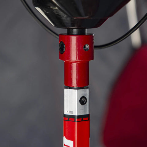 Close-up of Rock Solid Pistol Bit Adapter For Auger Powerheads, showing red heavy-duty construction for winter drilling.