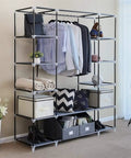Heavy Hitter Portable Closet Wardrobe Organizer With Slick Nonwoven Fabric Cover And Beefy Steel Frame Built Solid For No Sweat Roomy Storage Shelves And Long Hanging Rod In Soft Gray with clothes and accessories displayed.