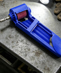 Rugged Cordless Angle Grinder Kit Delivers High Speed Cutting And Precision Smoothing With A Secure Anti Loosening Lock tool resting on a metal surface.