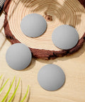 Gray Silicone Door Handle Buffer Guards 4 Pack Self Adhesive Wall Protectors on a wooden surface