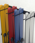 Heavy Duty Ski Wall Mount Rack For Garage And Home Badass Modular Storage System Holds Eight Pairs Of Skis And Poles displayed with colorful skis.