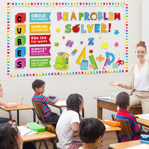 Classroom with "Be A Problem Solver" math bulletin board cutouts featuring colorful symbols for elementary and preschool inspiration.