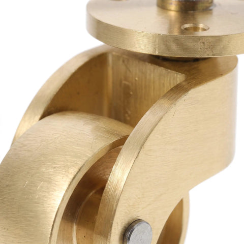 Close-up view of heavy duty swivel caster showing brass finish and smooth rolling mechanism for furniture wheels.